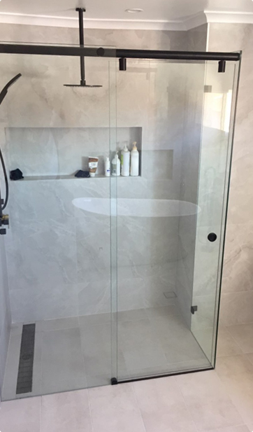 Sliding shower screen installed in a modern Canterbury-Bankstown bathroom – sleek design by Ezy Glide Shower Screens.